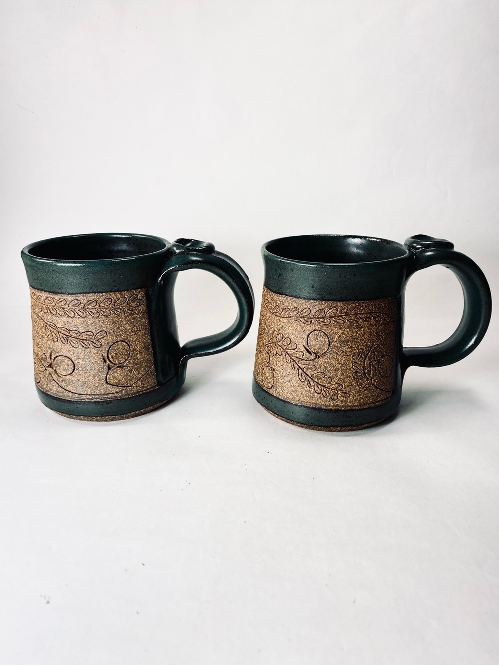 2 Handcrafted Pottery Mugs by Lynne Deep Teal Green Glaze Floral Etched Detail